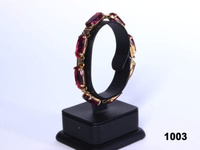 Pretty costume jewellery bracelet in gilt metal with oval pink cut glass stones throughout from Antiques of Kingston