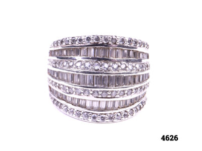 925 Sterling silver ring with alternating layers of round and baguette cut cubic zirconia stones Front view.