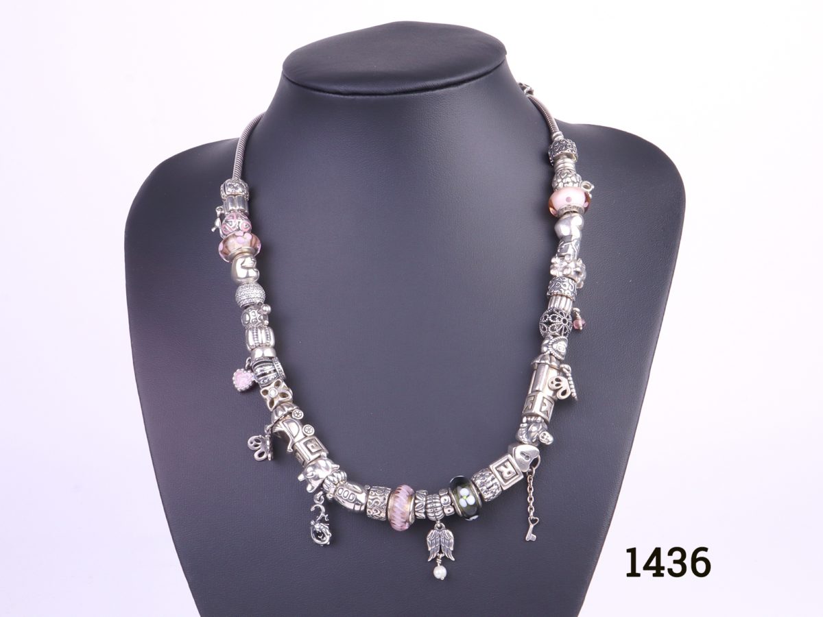 Pandora solid silver necklace fully loaded with 41 charms and a safety catch All hallmarked Ale 925 Necklace weighs 158.4g Main photo showing front view of necklace on display stand