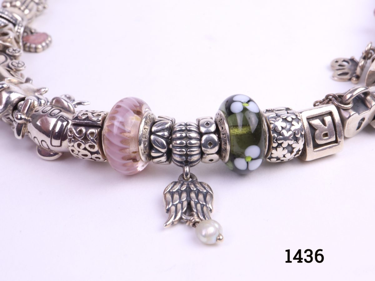 Pandora solid silver necklace fully loaded with 41 charms and a safety catch All hallmarked Ale 925 Another close up photo of some charms
