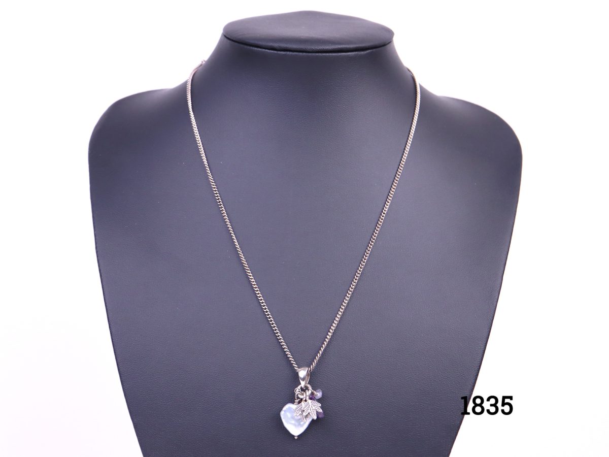 Azuni sterling silver necklace decorated with pearlised heart, leaves & crystal glass bead charms from Antiques of Kingston. Pendant drop length 30mm.
