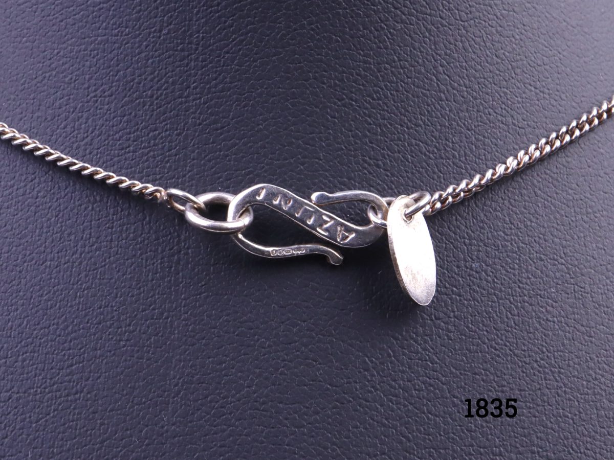 Azuni sterling silver necklace decorated with pearlised heart, leaves & crystal glass bead charms. Fully hallmarked c2006 London assayed Pendant drop length 30mm. Close up of the clasp with Azuni stamp visible