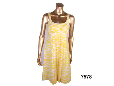 Vintage Calvin Klein strap dress in yellow and white cotton. Side zip fastening. Size 10 Main photo front view of dress on mannequin from Antiques of Kingston