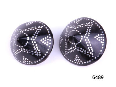 Yemenite coral clip on earrings. Vintage black coral clip-on earrings from Yemen with inlaid silver decoration. Both clips in good order. Measures 30mm in diameter and 18mm deep. Main photo of earrings from front.