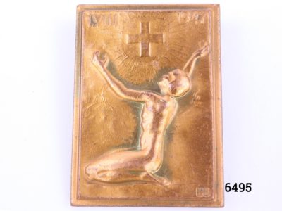 Vintage Swiss Red Cross badge designed by Huguenin from Le Locle region in Switzerland and signed by Hans Frei to the front In coppered bronze with pin in good order Main photo of badge front under studio light