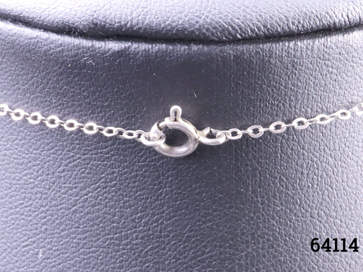 c1978 Hand-painted porcelain pendant by Toshikane of Japan mounted on a silver frame and sterling silver chain. Pendant frame fully hallmarked for Birmingham assay. Pendant measures 35mm long from top of bail to base and 25mm wide. Close up photo of the clasp