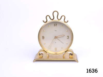 Vintage 1970s Swiss made 8 day desk clock alarm by ImHof. Clock face measures 75mm in diameter. (Some signs of wear) Fully serviced and guaranteed for 1 year from date of purchase Main photo showing the clock from the front