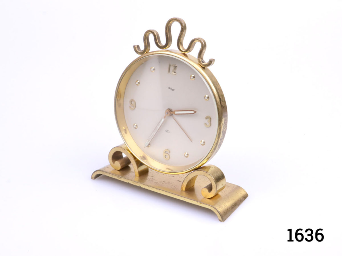 Vintage 1970s Swiss made 8 day desk clock alarm by ImHof. Clock face measures 75mm in diameter. (Some signs of wear) Fully serviced and guaranteed for 1 year from date of purchase Photo of clock from a slight side angle