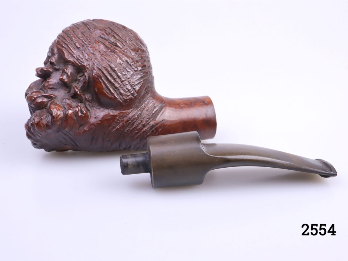 Vintage carved wooden smokers pipe with the head of an Eastern gentleman at the bowl. Marked Red Point Old Briar to the side. Head at bowl measures 55mm long by 48mm wide (at top) and 66mm high Photo of bowl end detached from mouthpiece