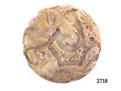 Carved soapstone lidded pot decorated with lion and elephant to the lid and lions and deer to the sides Measures 80mm in diameter Photo lookng directly down at the lid showing the lion and elephant carved into top