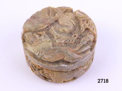 Carved soapstone lidded pot decorated with lion and elephant to the lid and lions and deer to the sides Measures 80mm in diameter Main photo showing pot from a slight raised angle showing depth