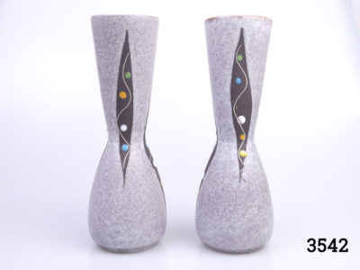 Pair of 1950s small West German vases. Speckled grey pattern with a modernist 'peas in a pod' decoration and reddish brown interior. Each measures 55mm in diameter at base, 57mm across the top and 205mm tall Main photo showing both vases side by side from an eye level angle