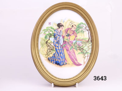 Pair of vintage oval gilt framed Oriental porcelain pictures. Hand-painted with scenes of courting couples in an Oriental setting. Felt peeling at back. Photo of picture showing couple admiring magnolia blossoms
