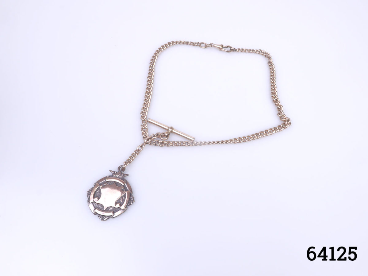 Victorian watch chain and fob in gilt metal with copper decorated fob. Empty fob shield for personalisation. Fob measures 40mm long by 32mm wide Main photo showing whole fob and chain