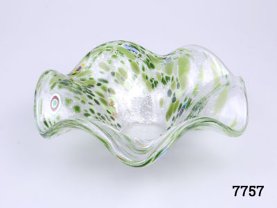 Vintage Murano glass dish. Speckled green swirl pattern gives it a sea urchin feel. Small chip on base. Measures 45mm in diameter at base and 175mm across the top Photo of bowl from a slightly raised angle
