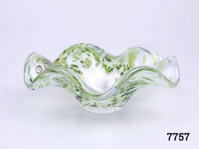Vintage Murano glass dish. Speckled green swirl pattern gives it a sea urchin feel. Small chip on base. Measures 45mm in diameter at base and 175mm across the top Main photo looking at bowl from an eye level angle