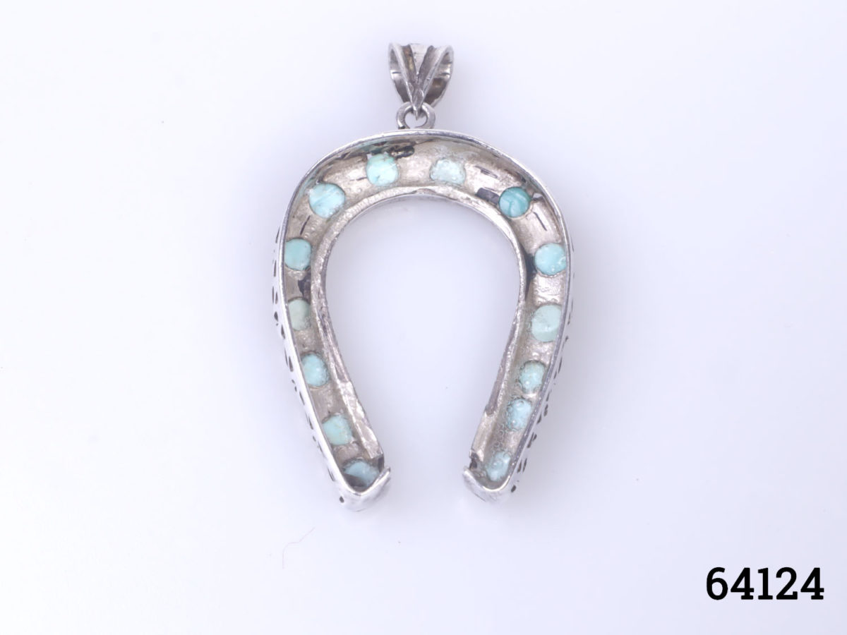 Vintage Egyptian silver horseshoe pendant. Lucky horseshoe encrusted with small turquoise bead stones all the way round. Drop length 45mm from bail Photo of back of pendant
