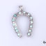 Vintage Egyptian silver horseshoe pendant. Lucky horseshoe encrusted with small turquoise bead stones all the way round. Drop length 45mm from bail Main photo of pendant on a flat surface with bail at the top and horseshoe ends at the bottom
