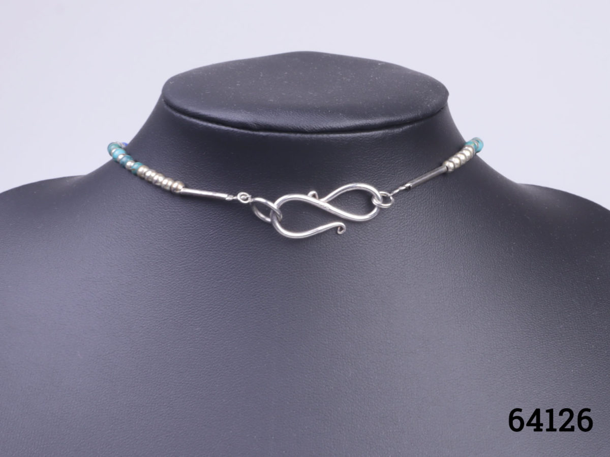 Vintage Tibetan silver necklace with turquoise and lapis lazuli beads and a lapis lazuli box pendant. Pendant has a secret compartment that opens at the back and measures 38mm long by 30mm wide Close up photo of the clasp