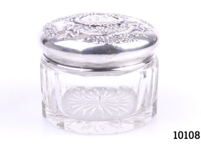 Sterling silver lidded glass pot. Vintage pot with heavily embossed silver lid Measures 85mm in diameter Main photo showing pot with lid in place from an eye level angle