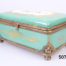 19th Century Paris porcelain box. Hand-painted box in sea green with floral design to centre of the lid with ormolou gilt metal edging and brass feet. Hand-painted picture signed by Renan Main photo showing box laid diagonally with one front corner in the foreground and with hand-painted picture on top of lid slightly visible