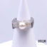 Chunky Modernist style sterling silver ring set with pearl to the centre and cubic zirconia to the sides below the pearl. Ring size P / 7.5. Ring weight 11.9 Main photo of ring displayed on a stand and seen from the front