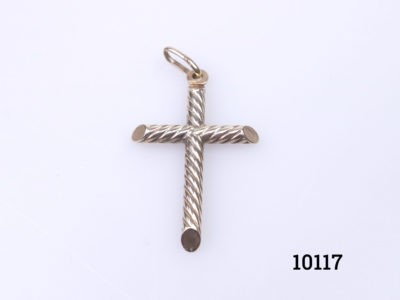 Vintage 9 karat gold cross in a rope twist design. Fully hallmarked to the bail for imported gold assay stamped in Sheffield and on the top of the cross. c1975-1998. Drop length 40mm Main photo of cross on a flat surface
