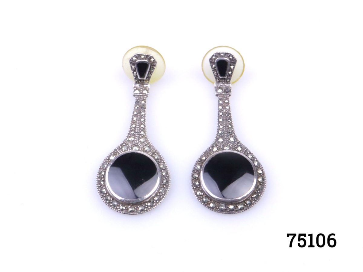 1980s Art Deco style earrings with jet & marcasite on silver. Hallmarked 925 for sterling silver.  Comes with plastic fastening at back for security. Silver butterflies can also be provided if preferred. Will be mailed boxed. Earrings weigh 11 grams. Drop length 50mm. With at widest part of earring at bottom 20mm. Main photo of both earrings laid on a flat surface