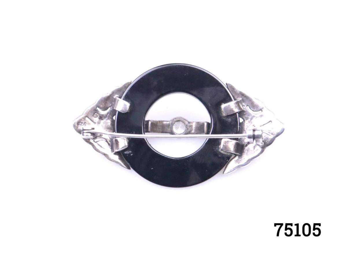 Art Deco style sterling silver and marcasite brooch with a ring of jet to the centre. Will be sent boxed. Brooch measures 62mm long by 35mm wide and weighs 17.7 grams Photo of back of brooch