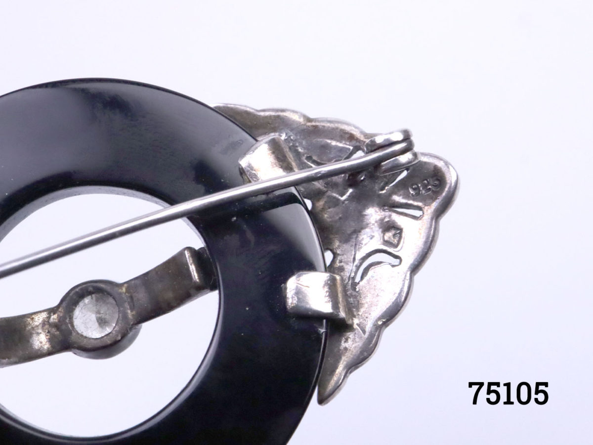 Art Deco style sterling silver and marcasite brooch with a ring of jet to the centre. Will be sent boxed. Brooch measures 62mm long by 35mm wide and weighs 17.7 grams Close up photo of the hallmark to the back of brooch
