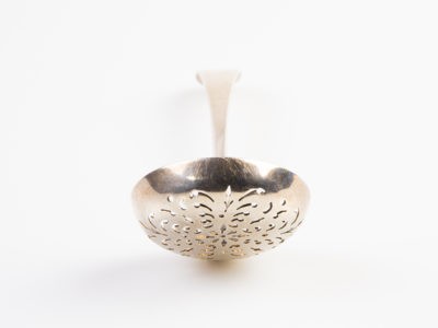 c1894 antique Victorian sterling silver sifter spoon. London assayed fully hallmarked sifter spoon made by Josiah Williams (George Maudsley Jackson) Spoon bowl measures 50mm in diameter Photo of spoon seen with strainer end in the foreground.