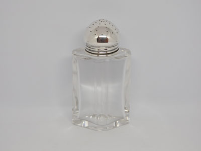 Continental silver topped sugar sifter. Lovely Deco sugar sifter with heavy crystal glass bottom and 835 silver top. Full hallmark to the side of the silver top believed to be of German origin. In excellent condition with no chips or cracks. Main photo showing sifter from a near eye level angle.