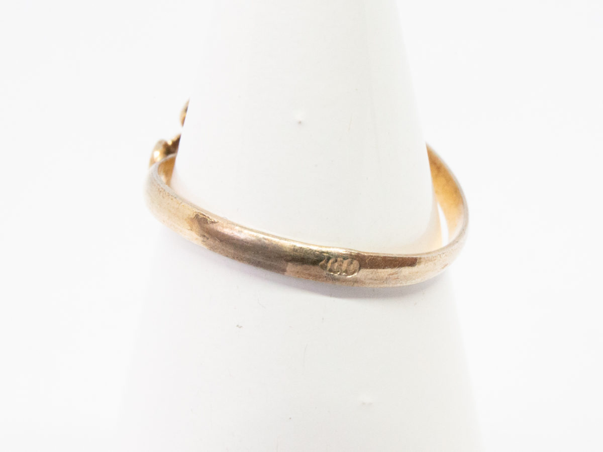 Continental carved coral roses ring. Pretty Continental gilt silver ring set with two carved red coral roses mounted on gilt silver leaves. Open band design. Size P. Hallmark to outside band (worn 800) Will be sent boxed. Photo of ring on a cone display stand showing the hallmark on the outside band.