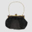 Vintage black satin bag. Very sweet bag in black satin with a gilt metal chain handle and frame studded with coloured stones. c1920s-1930s. In good order for age. Chain drop length approximately 150mm. Main photo showing bag with chain handle spread out and clasp opening side in the foreground.
