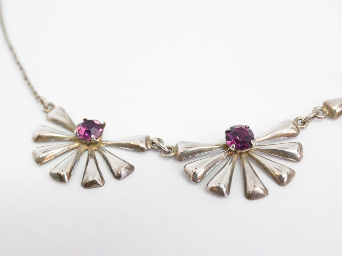 Each daisy measures approximately 30mm wide by 20mm deep. Close up photo of the 2 end daisies left of centre.