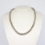Modern sterling silver necklace. Unusual silver necklace with a bubbles or water droplets like chain. Nice length so closer to neck like a choker. Hallmarked 925 to the link. Main photo of necklace displayed on a stand.