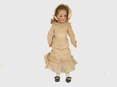 Antique Armand Marseille doll number 7. Petite bisque head doll in pale peach colour attire with incredibly realistic hand-painted features. Some wear to the clothing but otherwise in fabulous condition for a doll c1915. Measures approximately 335mm tall, 75mm wide at the hips and 55mm deep. Main photo of doll in an upright position and seen from the front.