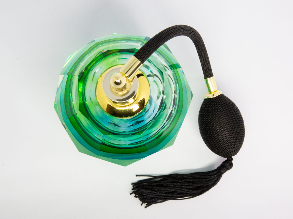 Mid century modern Murano glass perfume atomiser. A gorgeous hexagonal Murano Sommerso perfume atomiser bottle in aqua green and blue finished with a brass top and long black spray atomiser bulb. Attributed to Flavio Poli. Measures 55mm in diameter at base and 85mm in diameter at most bulbous central area. Photo of bottle shown looking straight down from above.