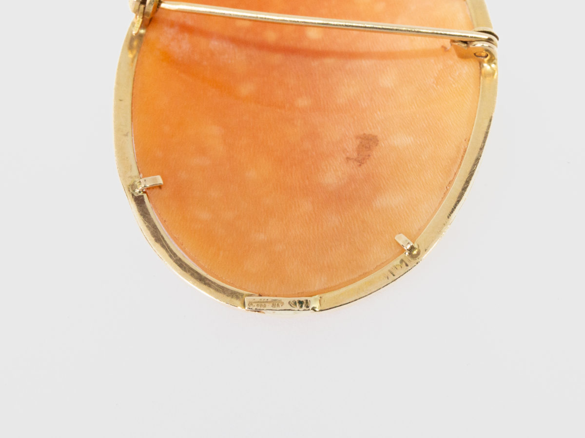 Antique 14 karat gold cameo brooch/pendant. Beautiful 19th century Victorian antique cameo brooch or pendant set in a 14 karat gold frame. Full hallmark to the back. Measures 40mm by 32mm and weighs 4.9gms. Close up photo of the hallmark at the back of brooch.