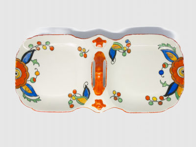 Art Deco sandwich set by Charlotte Rhead. A pretty and practical set comprising of a serving plate/tray with 2 shallow dish shaped plates connected with a handle to the centre and 6 small square side plates. Hand-painted in cheerful bright vibrant colours to cheer up any occasion. Design number 4133 'New Jazz' pattern c1928-1929. Each piece marked with the green Burleigh ware stamp with Rhead signature on the base of the serving plate. Visible crazing to each piece and some wear around the edge, especially around serving plate. Each small plate measure 145mm square and the serving plate/tray measures 330mm long,150mm wide and approximately 50mm tall by handle. Photo of serving platter only seen looking straight down from above.