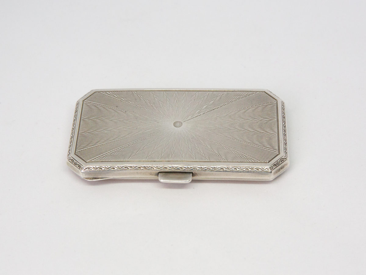 Ladies guilloche enamel and silver cheroot case. Stunning ladies Art Deco cheroot case with yellow guilloche enamel to one side. 925 hallmark for sterling silver in several areas. Gilded interior. In wonderful condition throughout and closes tight. Missing the elasticated band inside. Import mark for Glasgow c1925. Made by Scholl Ltd. Photo of the reverse side of enamelled case showing the lovely pattern detail in the silver.