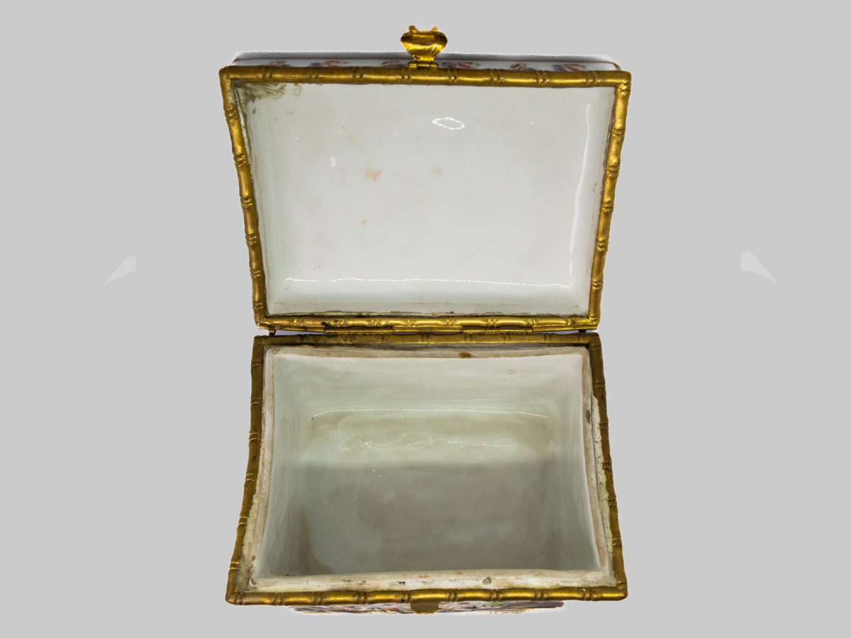 Late 19th century Naples porcelain box. A heavy porcelain box moulded in high relief with scenes of scantily clad men and women disporting themselves in various ways. Beautifully hand-painted in bright vibrant colours and finished off with gilt accent. Photo of box with lid open showing interior of both box and lid.
