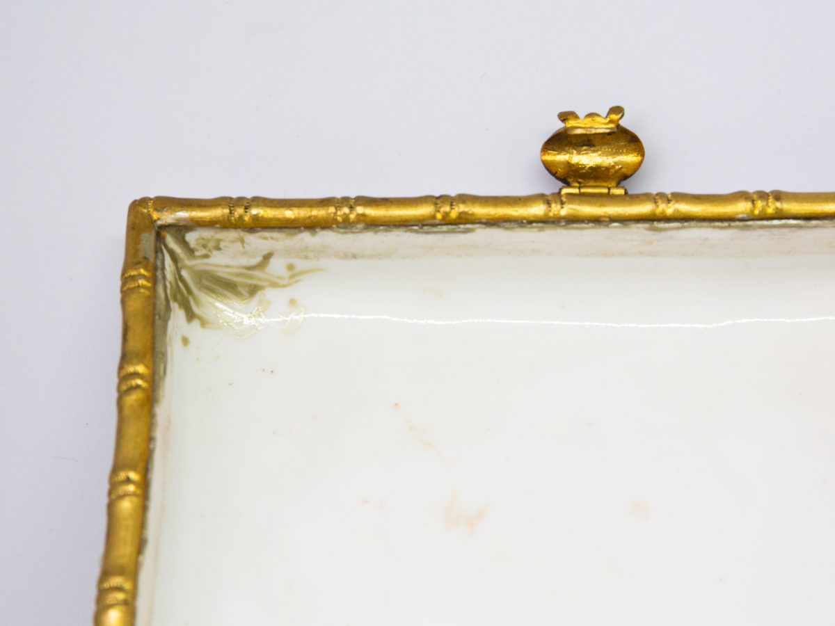 Late 19th century Naples porcelain box. A heavy porcelain box moulded in high relief with scenes of scantily clad men and women disporting themselves in various ways. Beautifully hand-painted in bright vibrant colours and finished off with gilt accent. Close up photo of some discolouration in the left corner of lid possibly from a previous repair.