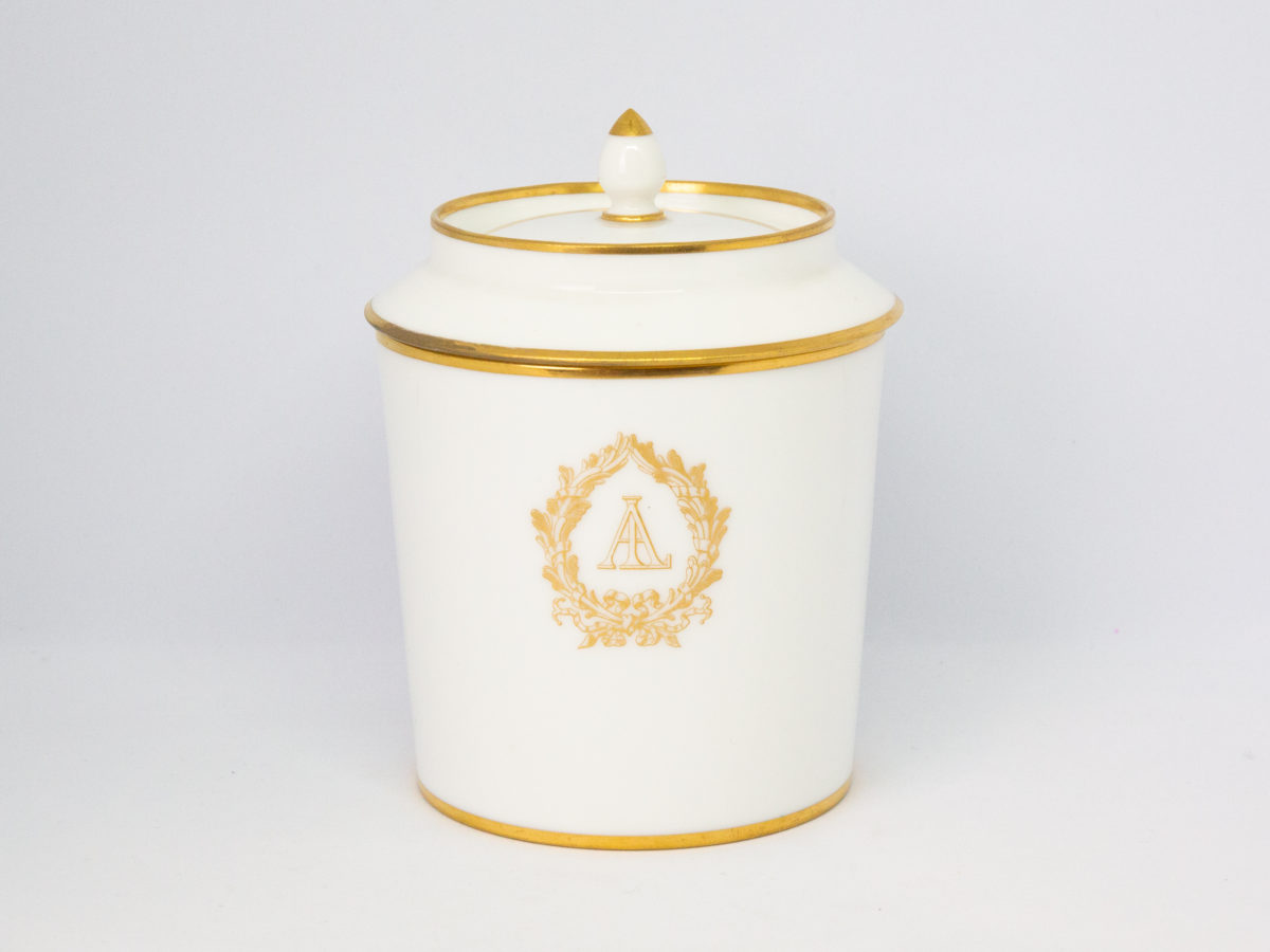 c1890 Dore a Sèvres lidded pot. Fine quality antique lidded pot in white porcelain with gilt accent. In excellent condition for its age. Stamped to base. Measures 85mm in diameter, top opening measures 95mm in diameter and lid overhangs at 102mm in diameter. Main photo of pot with lid in place and seen from an eye level angle from the front with laurel wreath around lettering shown.