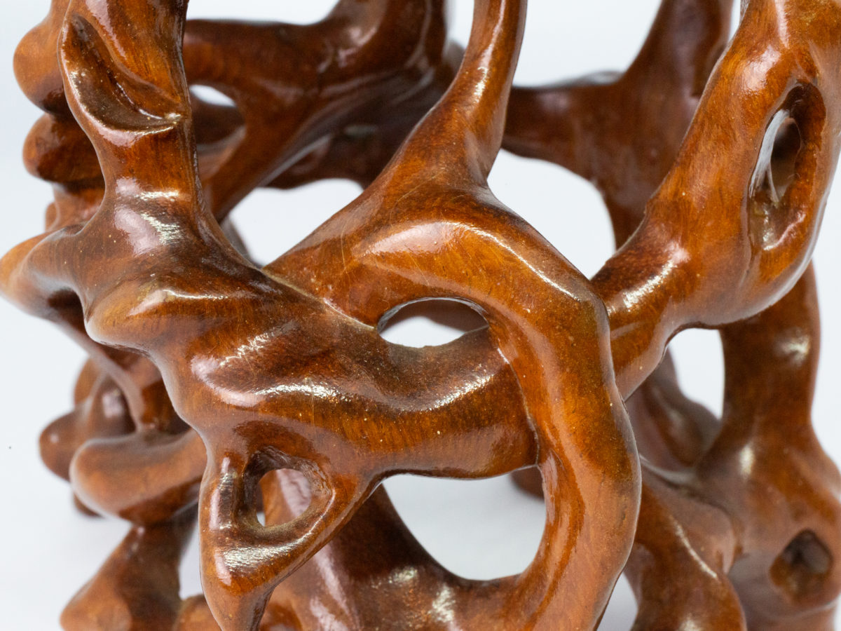 Vintage Chinese carved root stand. A carved hardwood root form stand finished in a hard wearing glossy varnish. Some minor scuff marks to the flat top. Measures 145mm long and 135mm wide at base. Flat top area measures 140mm at longest and 125mm at widest. Close up photo of part of the intricate carving work to the knotted roots.
