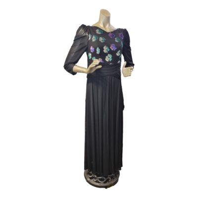 1980s Hoffman long black evening dress  with silk bodice and metallic embellishment. Jersey mesh stretch skirt and sheer sleeves. Will fit size 10. Main photo of dress from the front and full length.