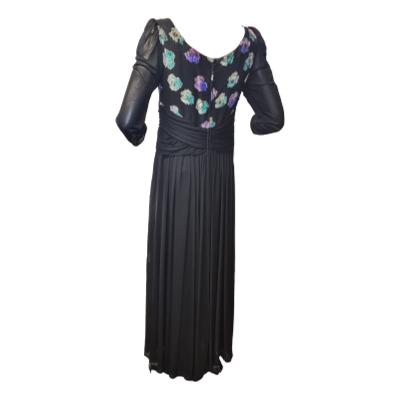 1980s Hoffman long black evening dress  with silk bodice and metallic embellishment. Jersey mesh stretch skirt and sheer sleeves. Will fit size 10. Photo of back of dress.