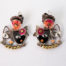 Modern pair of pretty cat earrings. Pretty pair of pampered cat earrings by the wonderful Taratata. Metal with enamel and pink felt flowers. Has a Picasso-esque look. Super large butterfly for secure fastening. Signed Taratata to the back. Drop length approximately 22mm and 18mm at widest. Main photo of both earrings laid side by side on a flat surface and shown looking away from each other.