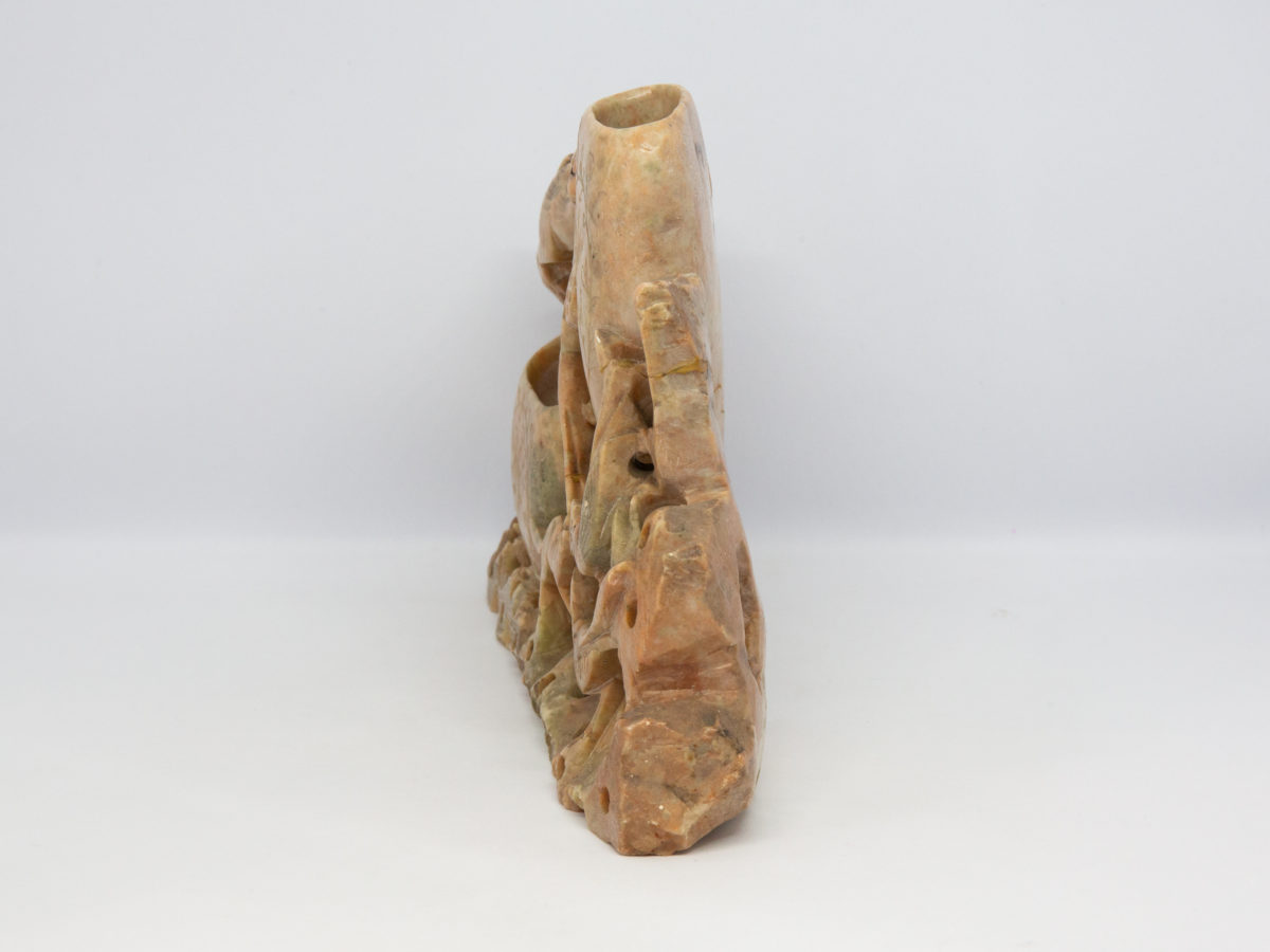 Vintage Oriental soapstone brush pot. Wonderful brush pot with a scene of wildlife gorging on lotus roots and seeds. 2 pots for brushes which are both engraved with a foliage design. Taller pot has crack across the base and both pots have sustained chips. Slight wobble from uneven base. Measures approximately 195mm at base, 35mm at widest and 132mm at tallest. Photo of pot from the side showing the depth.