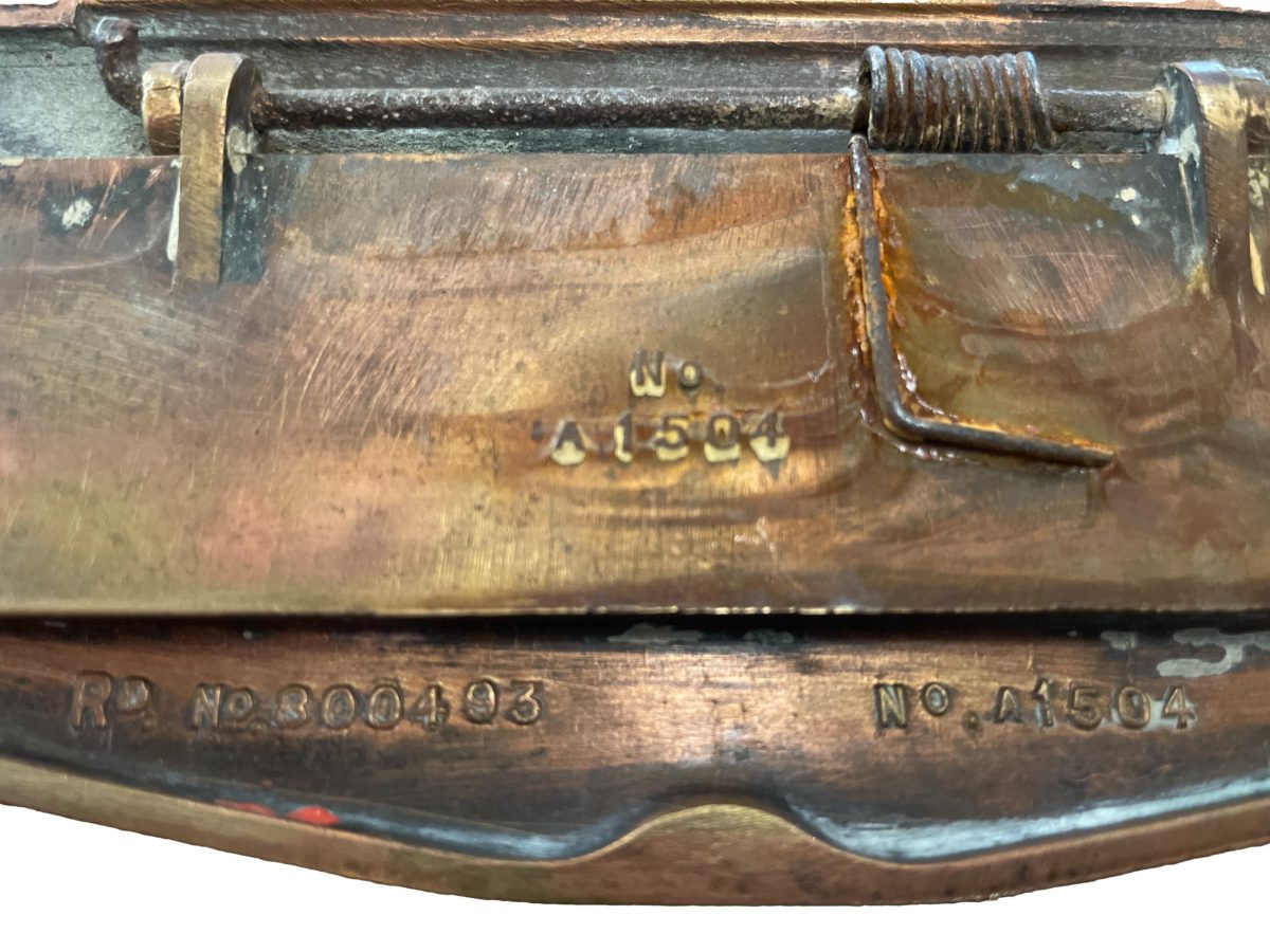 Solid brass Art Deco letter slot door furniture. RD number 800493 Close up photo of the Rd number and other numbers of manufacture.